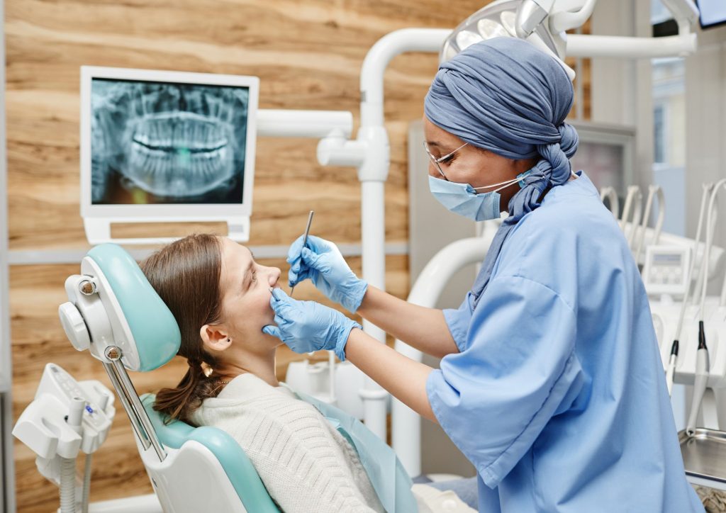 What is an apicoectomy and why is it performed?